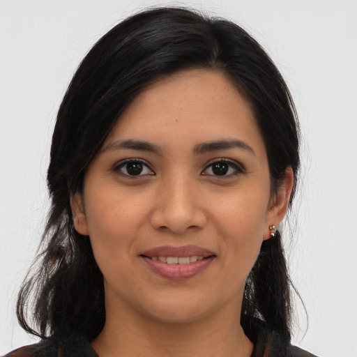 Joyful asian young-adult female with long  brown hair and brown eyes