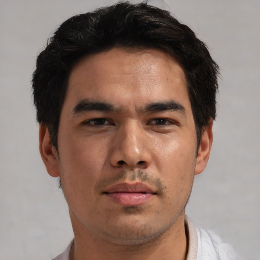 Joyful asian young-adult male with short  black hair and brown eyes