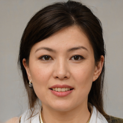 Joyful white young-adult female with medium  brown hair and brown eyes