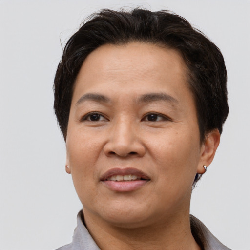 Joyful asian adult female with short  brown hair and brown eyes