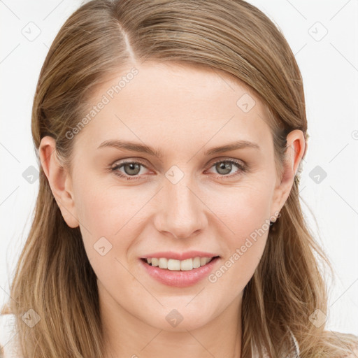 Joyful white young-adult female with long  brown hair and blue eyes