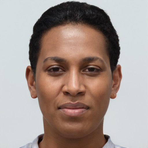 Joyful latino young-adult female with short  black hair and brown eyes