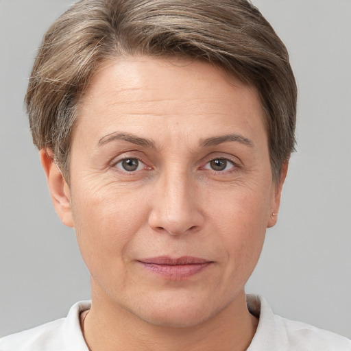 Joyful white adult female with short  brown hair and brown eyes