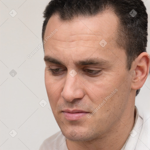 Joyful white adult male with short  brown hair and brown eyes