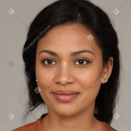 Joyful black young-adult female with medium  brown hair and brown eyes