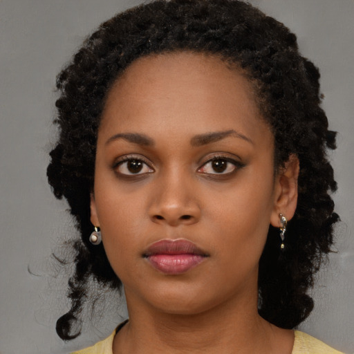 Neutral black young-adult female with medium  black hair and brown eyes