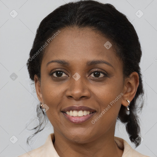 Joyful black young-adult female with medium  brown hair and brown eyes