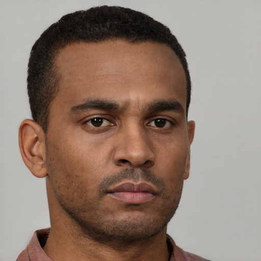 Neutral latino young-adult male with short  brown hair and brown eyes