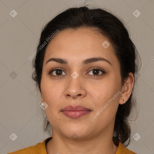 Joyful latino young-adult female with medium  brown hair and brown eyes