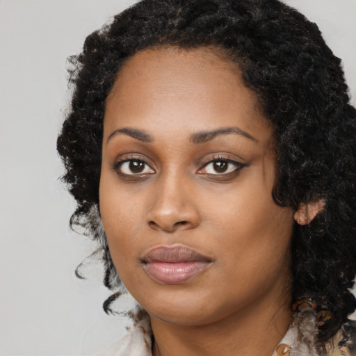 Neutral black young-adult female with long  black hair and brown eyes