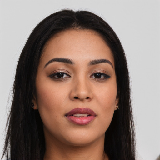 Joyful asian young-adult female with long  brown hair and brown eyes