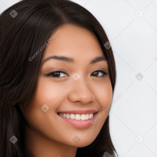 Joyful latino young-adult female with long  brown hair and brown eyes