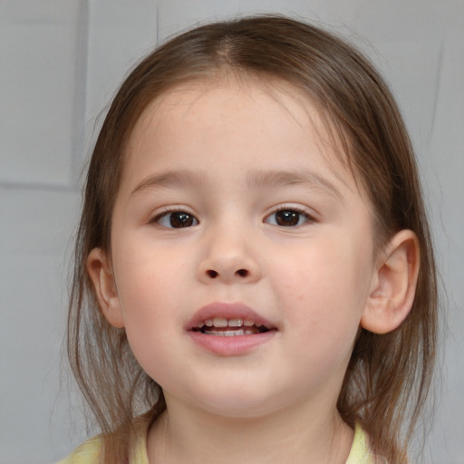 Joyful white child female with medium  brown hair and brown eyes