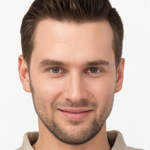 Joyful white young-adult male with short  brown hair and brown eyes