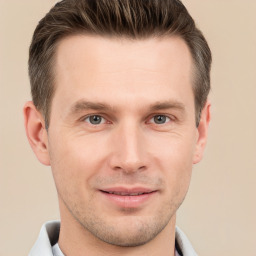 Joyful white adult male with short  brown hair and grey eyes