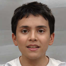 Joyful white child male with short  brown hair and brown eyes