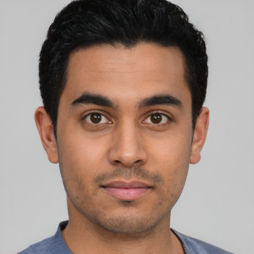 Neutral latino young-adult male with short  black hair and brown eyes