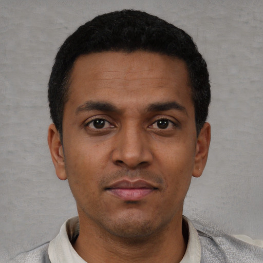Neutral latino young-adult male with short  black hair and brown eyes