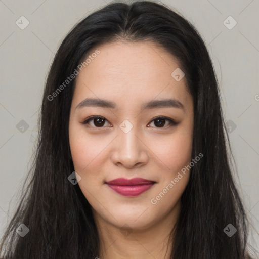 Joyful asian young-adult female with long  brown hair and brown eyes