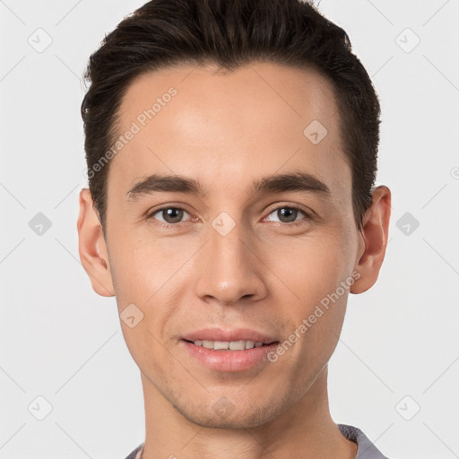 Joyful white young-adult male with short  brown hair and brown eyes