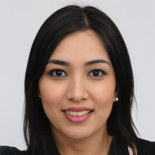 Joyful asian young-adult female with long  black hair and brown eyes