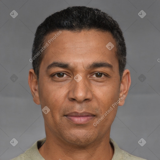 Joyful white adult male with short  black hair and brown eyes