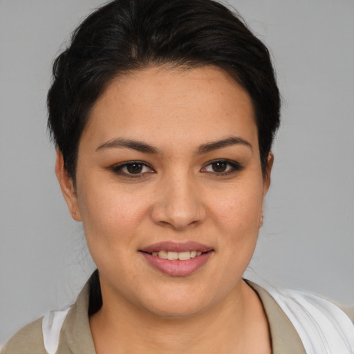Joyful asian young-adult female with medium  brown hair and brown eyes