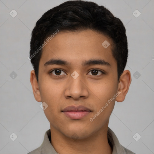 Joyful latino young-adult male with short  brown hair and brown eyes