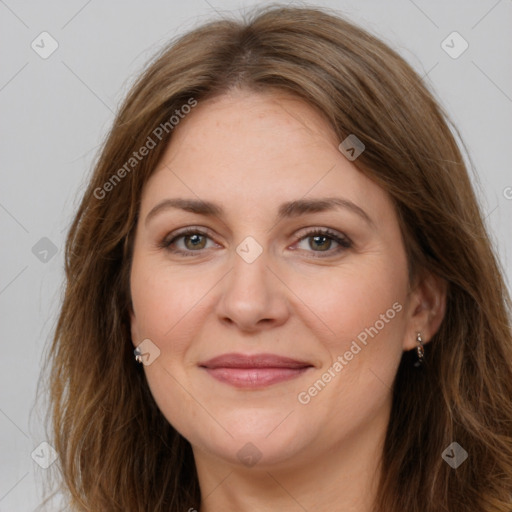 Joyful white adult female with long  brown hair and brown eyes