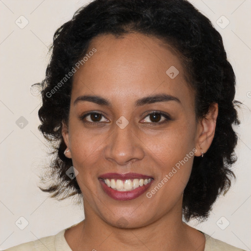 Joyful black young-adult female with medium  brown hair and brown eyes