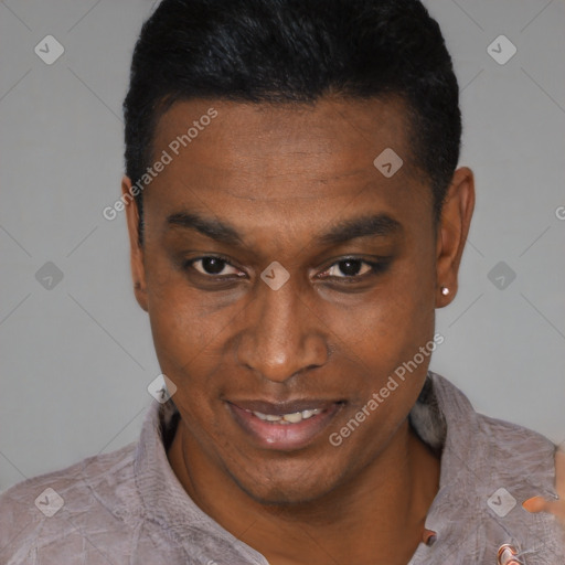 Joyful black young-adult male with short  black hair and brown eyes