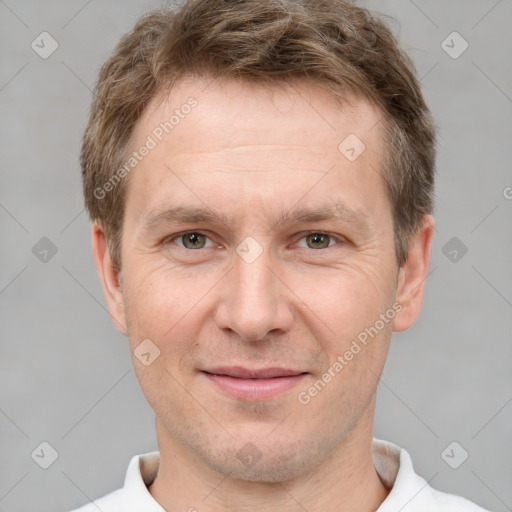 Joyful white adult male with short  brown hair and grey eyes