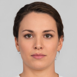 Neutral white young-adult female with short  brown hair and brown eyes