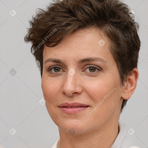 Joyful white adult female with short  brown hair and brown eyes