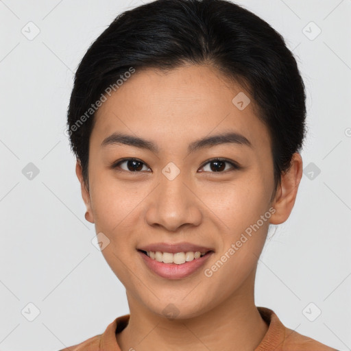 Joyful latino young-adult female with short  brown hair and brown eyes