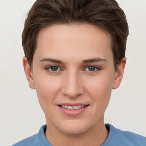 Joyful white young-adult female with short  brown hair and grey eyes