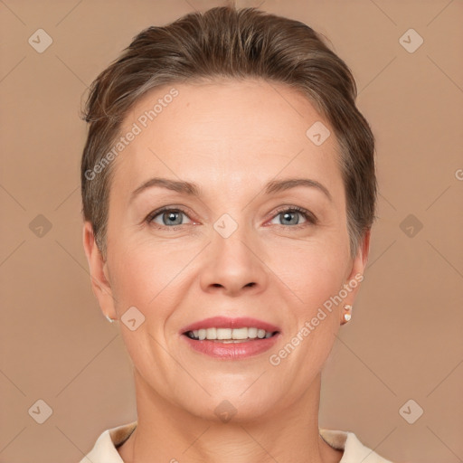 Joyful white adult female with short  brown hair and brown eyes