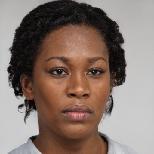 Neutral black young-adult female with medium  black hair and brown eyes