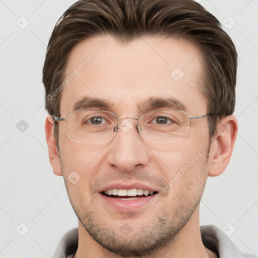 Joyful white adult male with short  brown hair and grey eyes