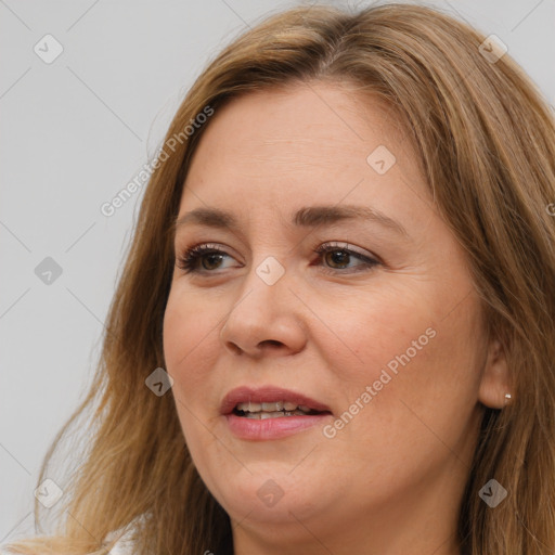 Joyful white adult female with long  brown hair and brown eyes