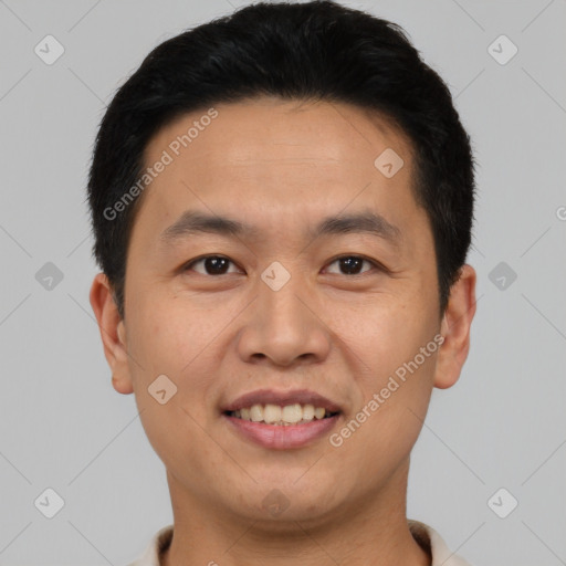 Joyful asian young-adult male with short  black hair and brown eyes