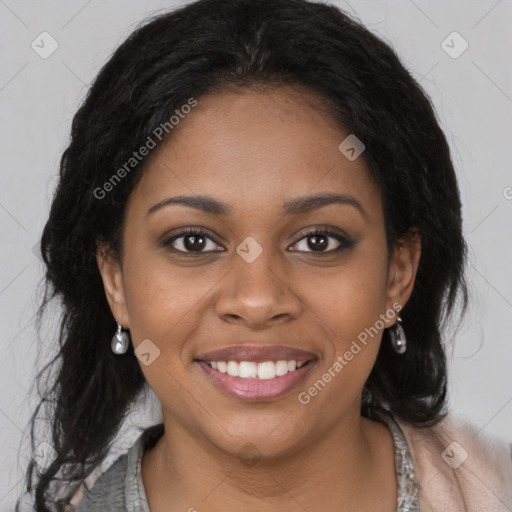 Joyful black young-adult female with long  brown hair and brown eyes