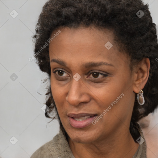 Joyful black adult female with short  brown hair and brown eyes