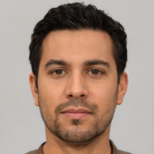 Neutral white young-adult male with short  black hair and brown eyes