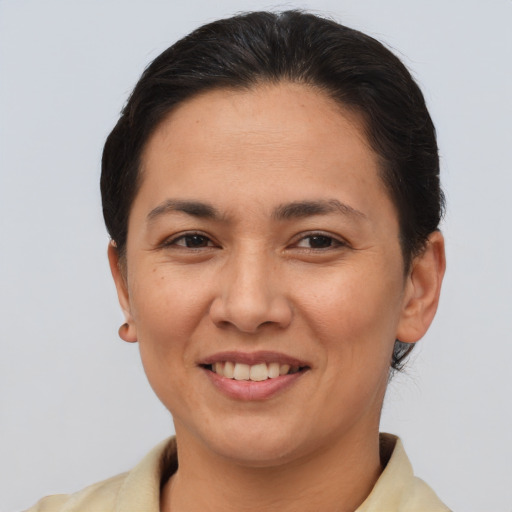 Joyful asian young-adult female with short  brown hair and brown eyes