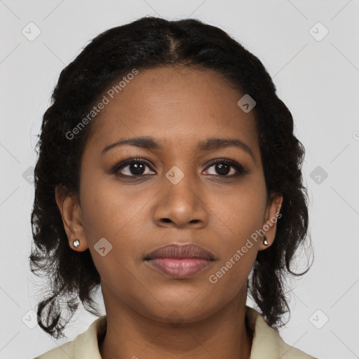 Joyful black young-adult female with long  brown hair and brown eyes