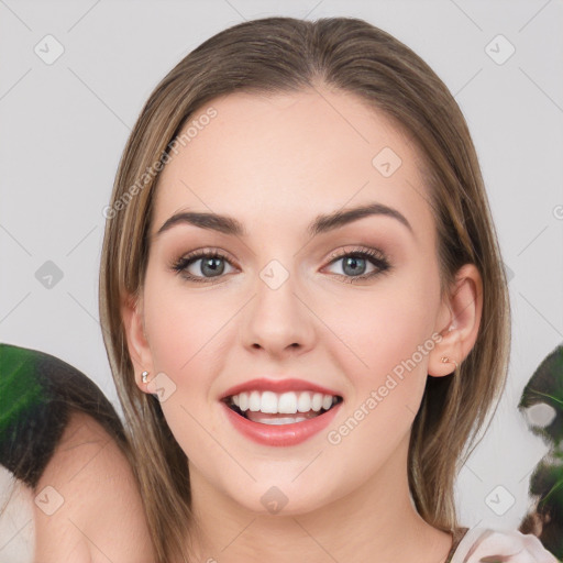 Joyful white young-adult female with medium  brown hair and green eyes