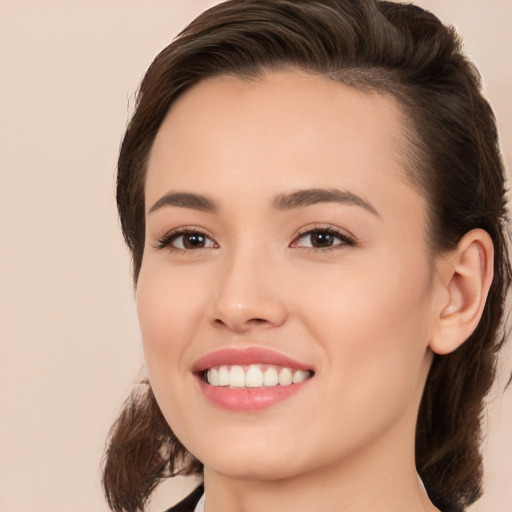 Joyful white young-adult female with medium  brown hair and brown eyes