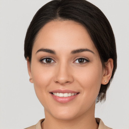 Joyful white young-adult female with medium  brown hair and brown eyes