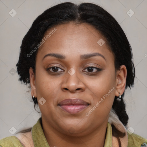 Joyful black adult female with medium  brown hair and brown eyes